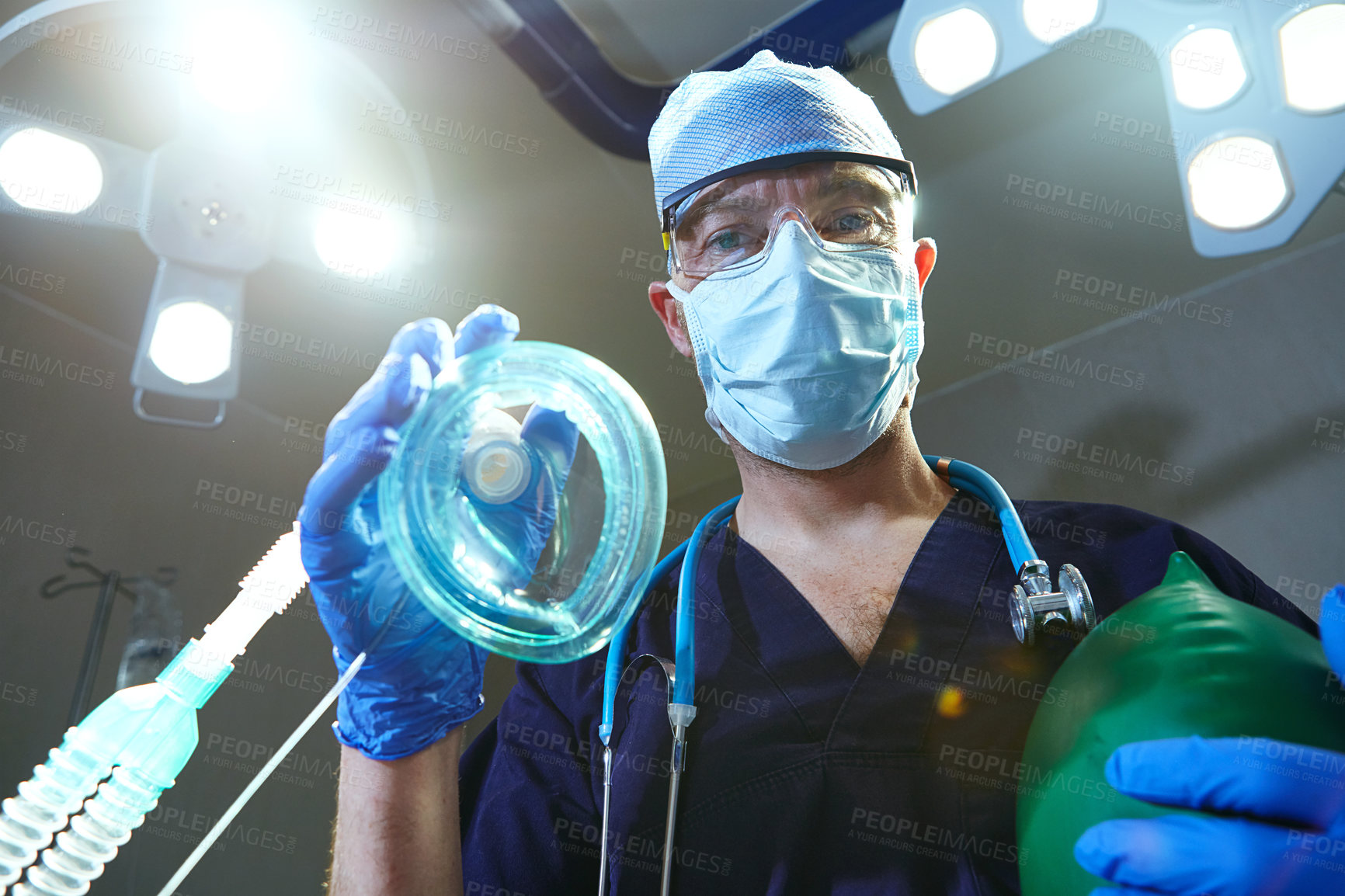 Buy stock photo Low angle shot of a surgeon in an operating room