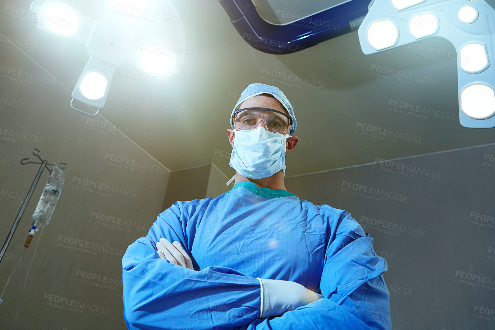 Buy stock photo Low angle shot of a surgeon in an operating room