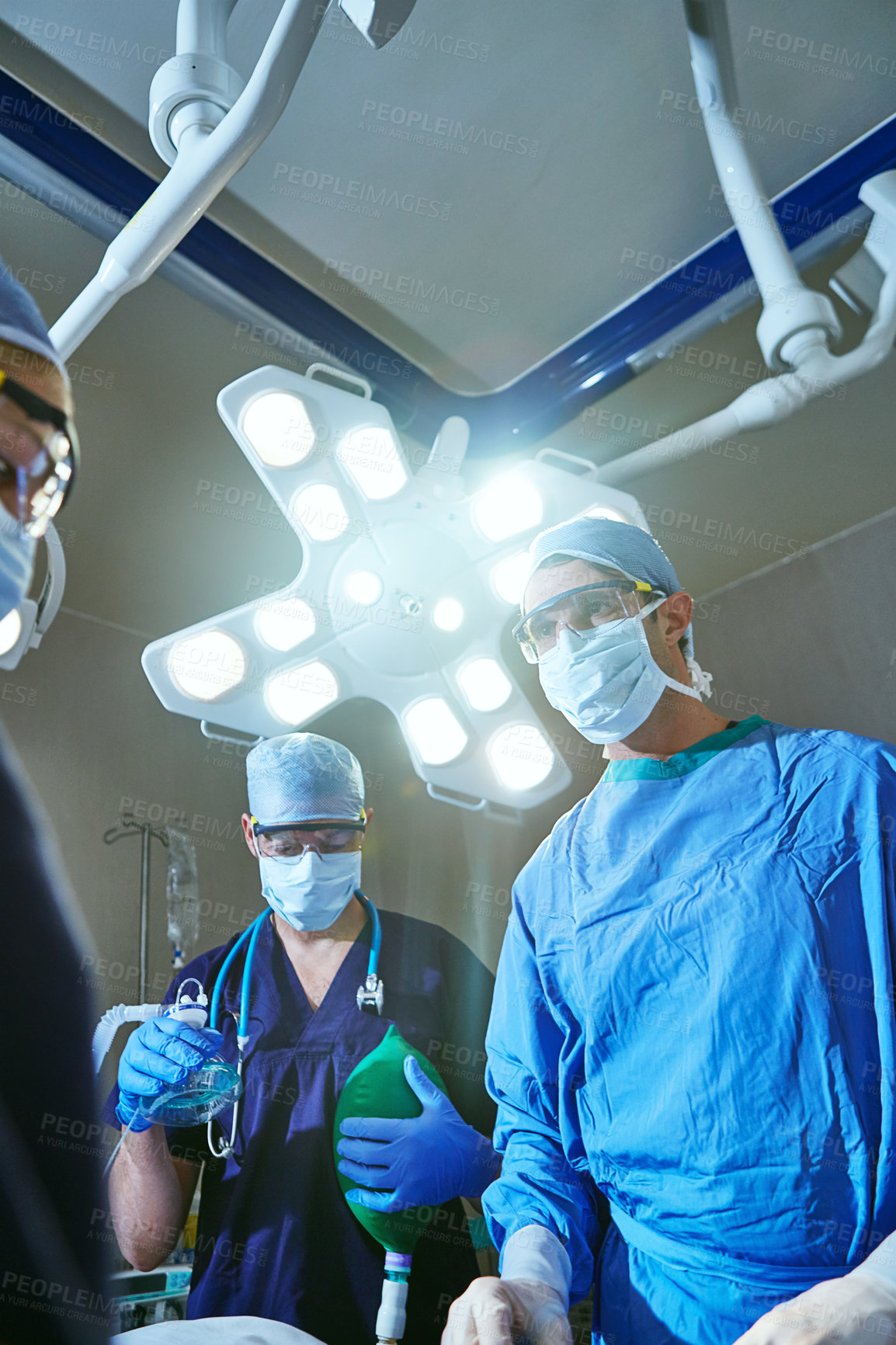 Buy stock photo Cropped shot of surgeons in an operating room