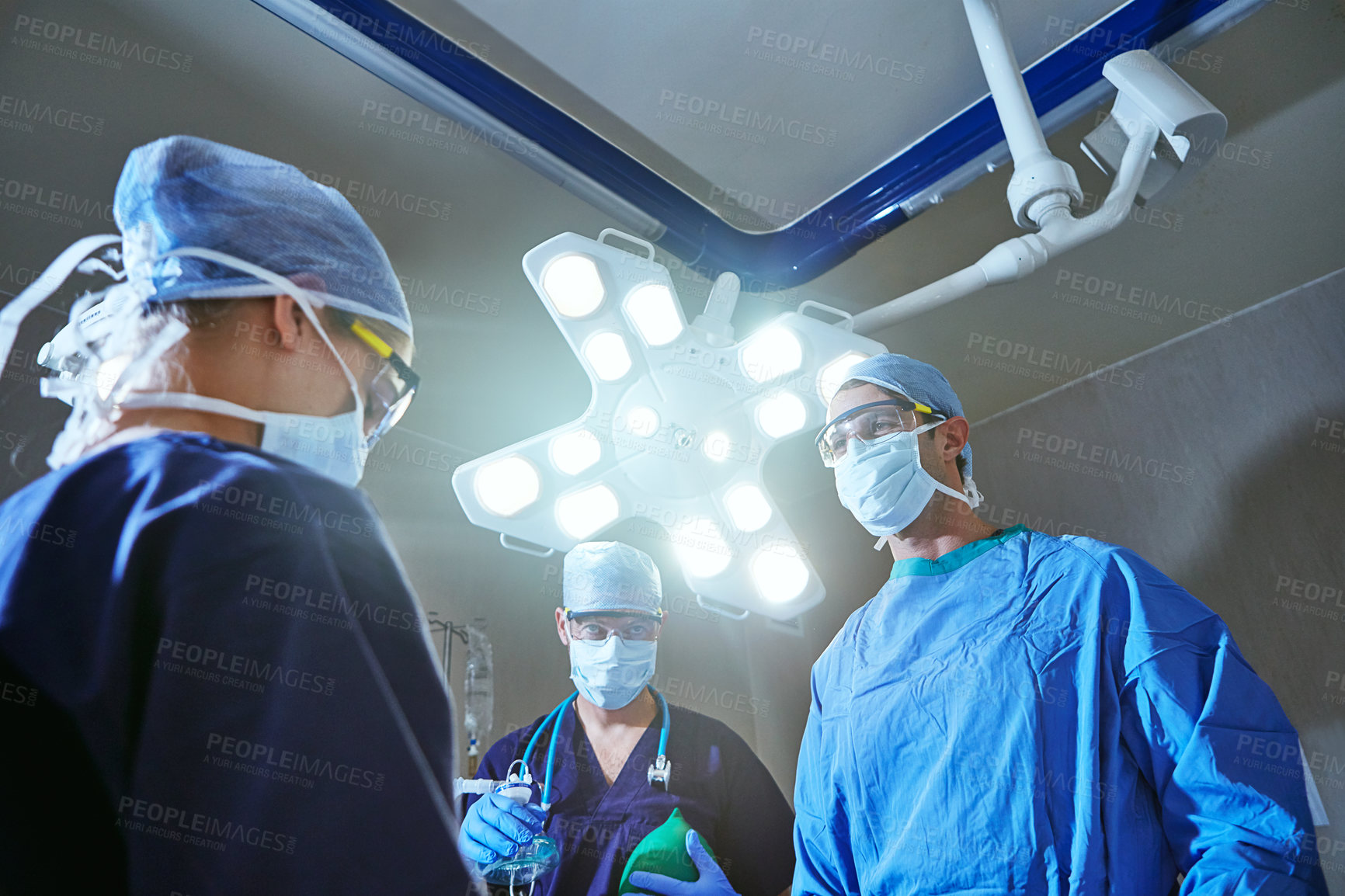 Buy stock photo Cropped shot of surgeons in an operating room