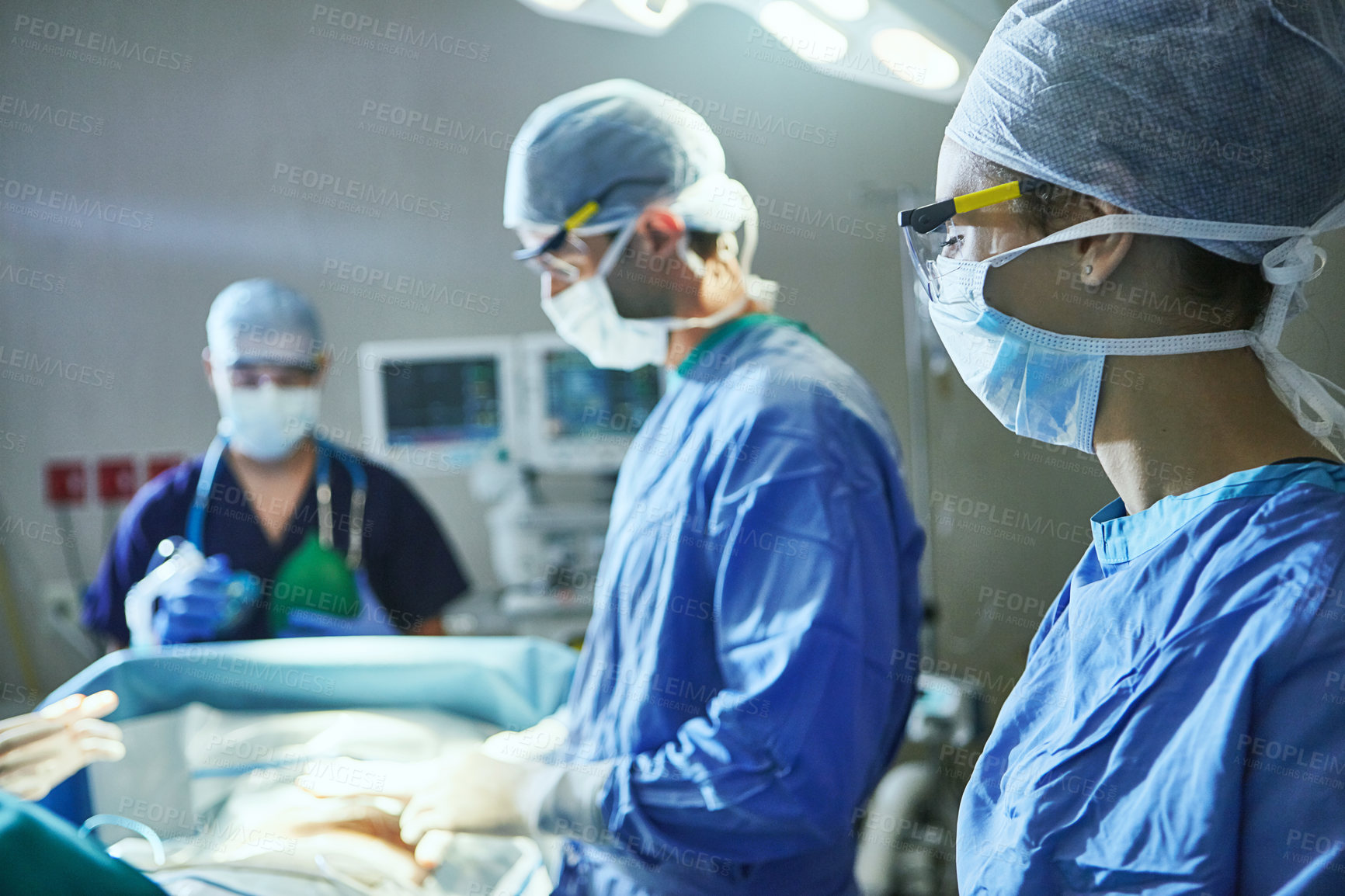 Buy stock photo Cropped shot of surgeons in an operating room