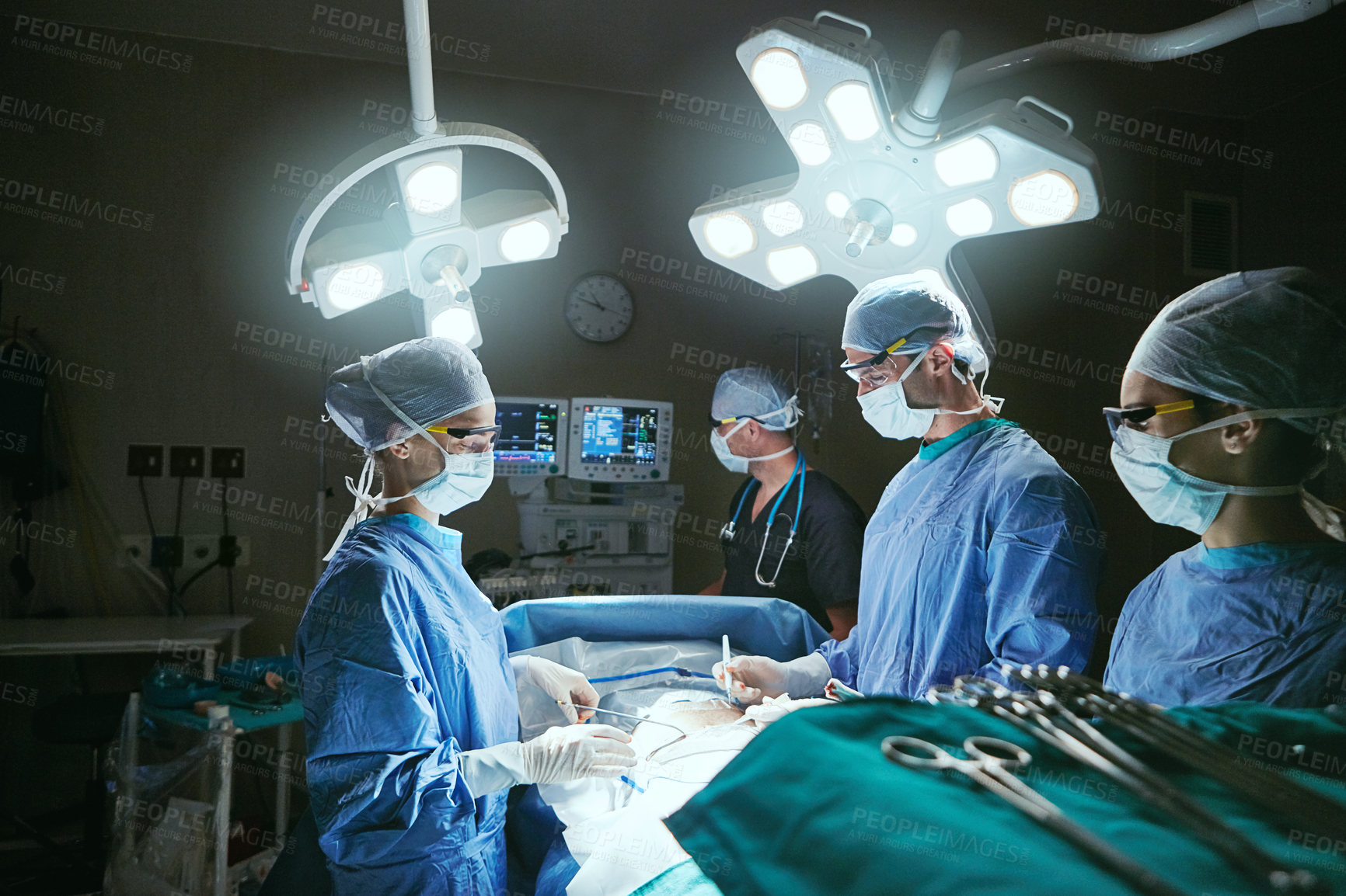 Buy stock photo People, collaboration and surgeons for surgery, teamwork and support for healthcare. Dark, hospital theater and nurse with tools, procedure and operation for cardiology and treatment in ICU clinic