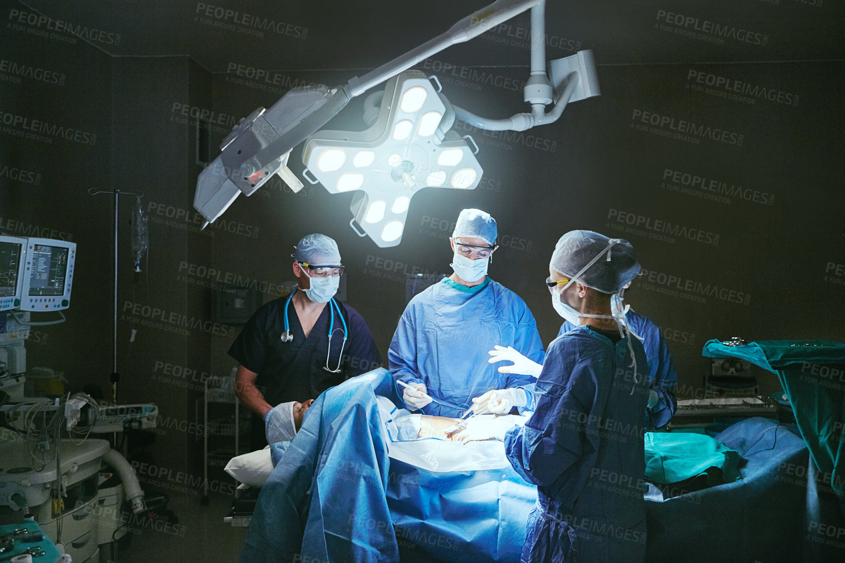 Buy stock photo Cropped shot of surgeons in an operating room