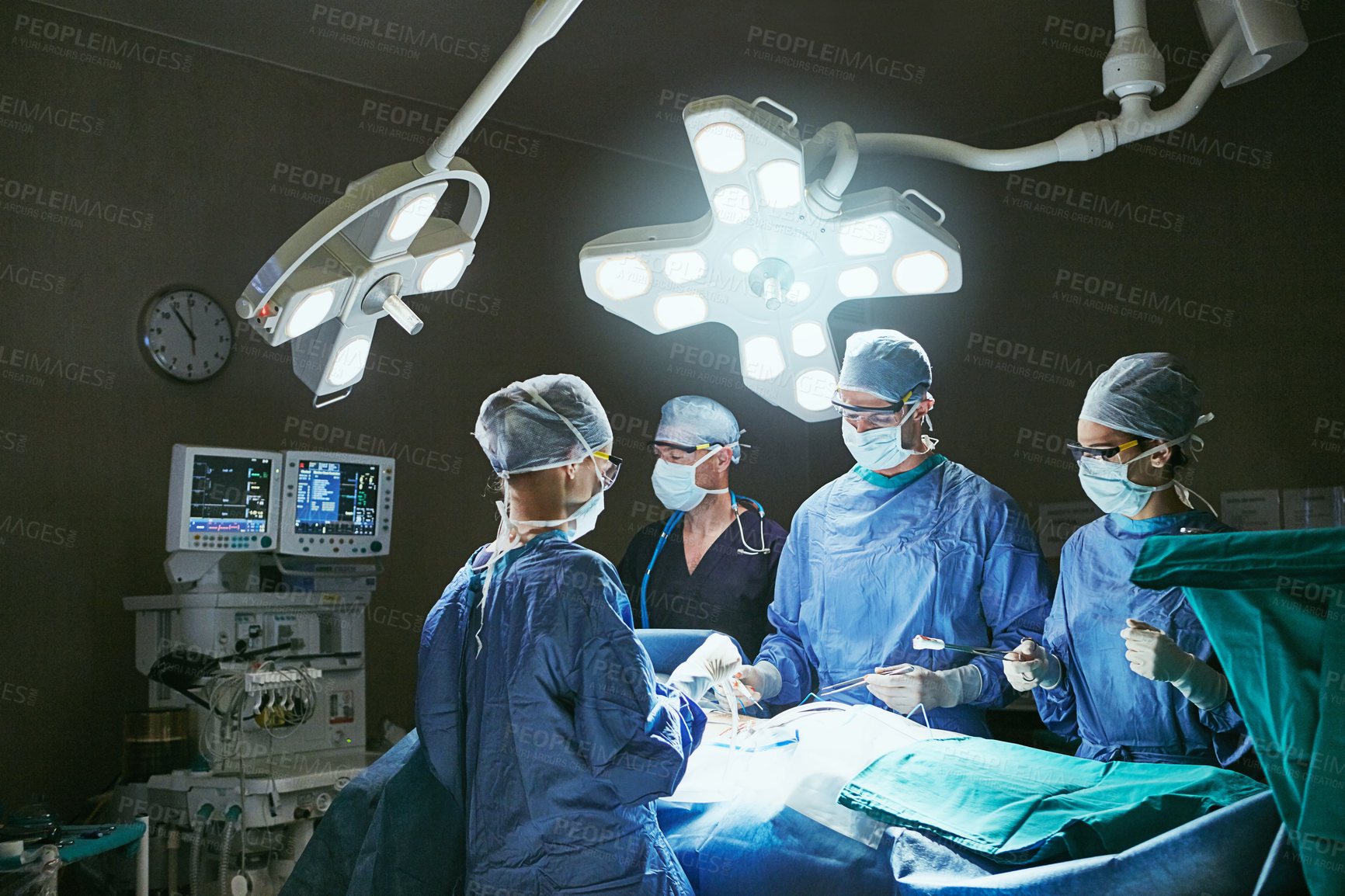 Buy stock photo Doctors, nurses and patient for surgery, teamwork and support for healthcare. Dark, hospital theater and people with collaboration, procedure and surgeons for cardiology and treatment in ICU clinic