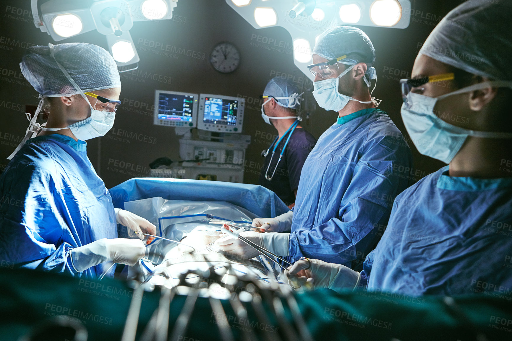 Buy stock photo Cropped shot of surgeons in an operating room