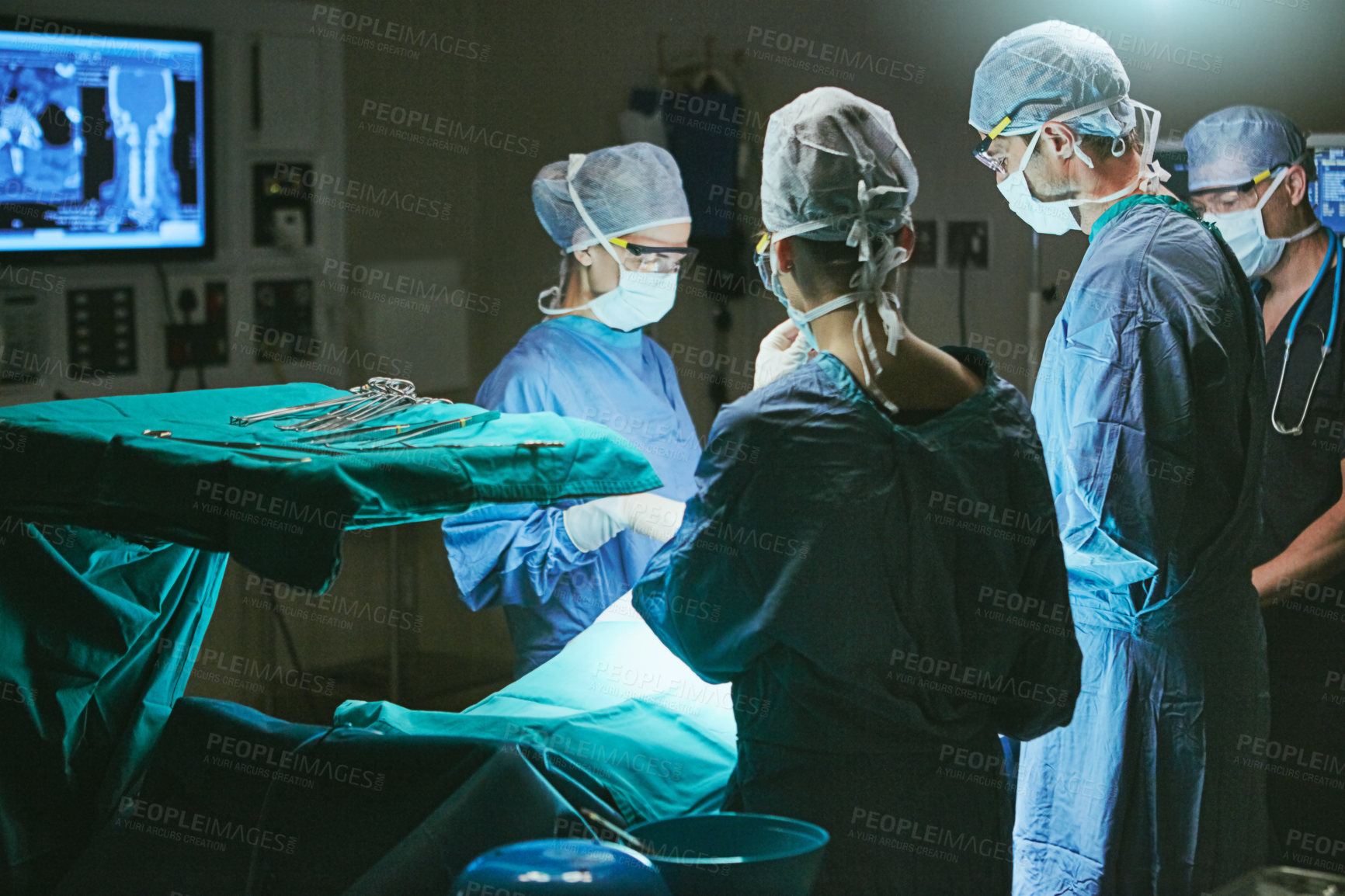 Buy stock photo Cropped shot of surgeons in an operating room