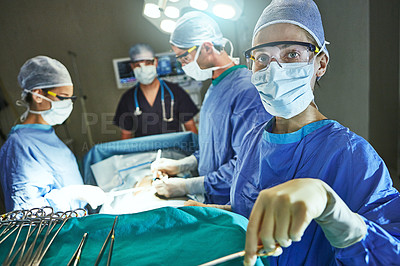 Buy stock photo Cropped shot of surgeons in an operating room