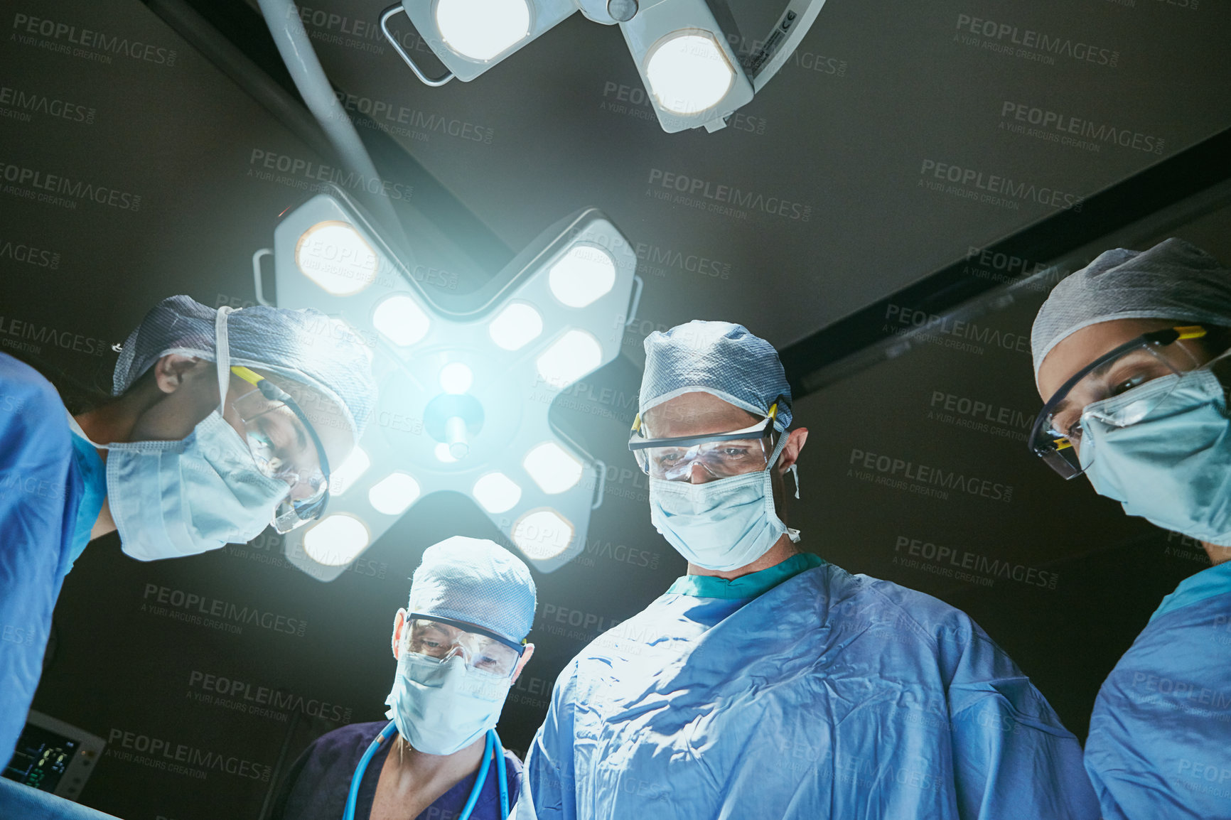 Buy stock photo Hospital, surgery and low angle of team of doctors in operation for emergency, medical service and procedure. Healthcare, crisis and surgeons with patient pov for injury, wellness and ICU treatment