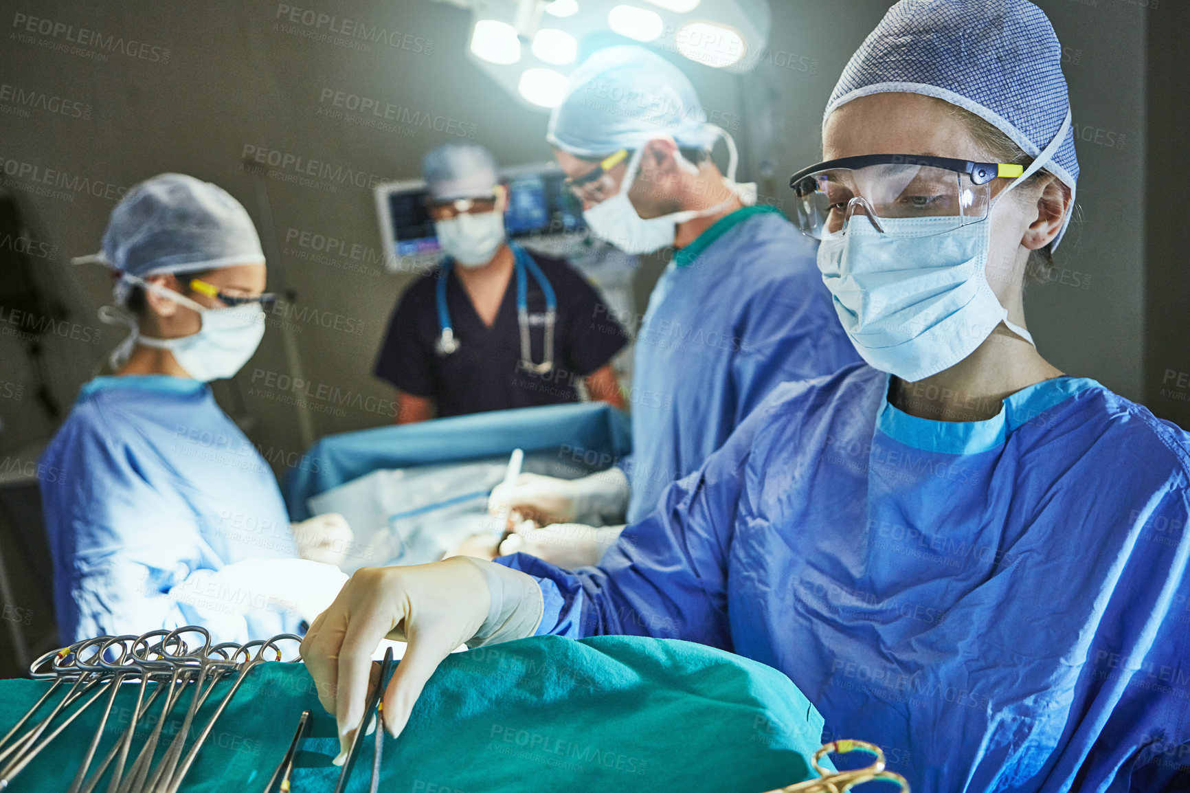 Buy stock photo Cropped shot of surgeons in an operating room