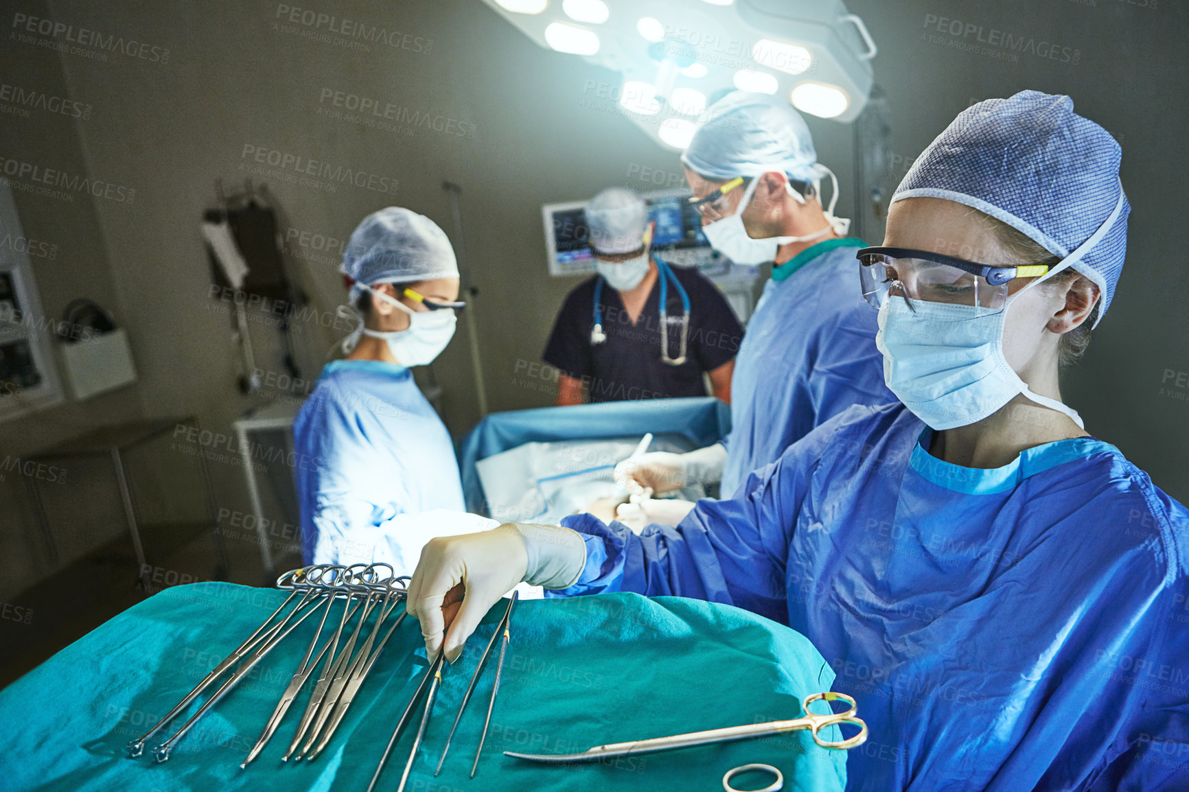 Buy stock photo Cropped shot of surgeons in an operating room