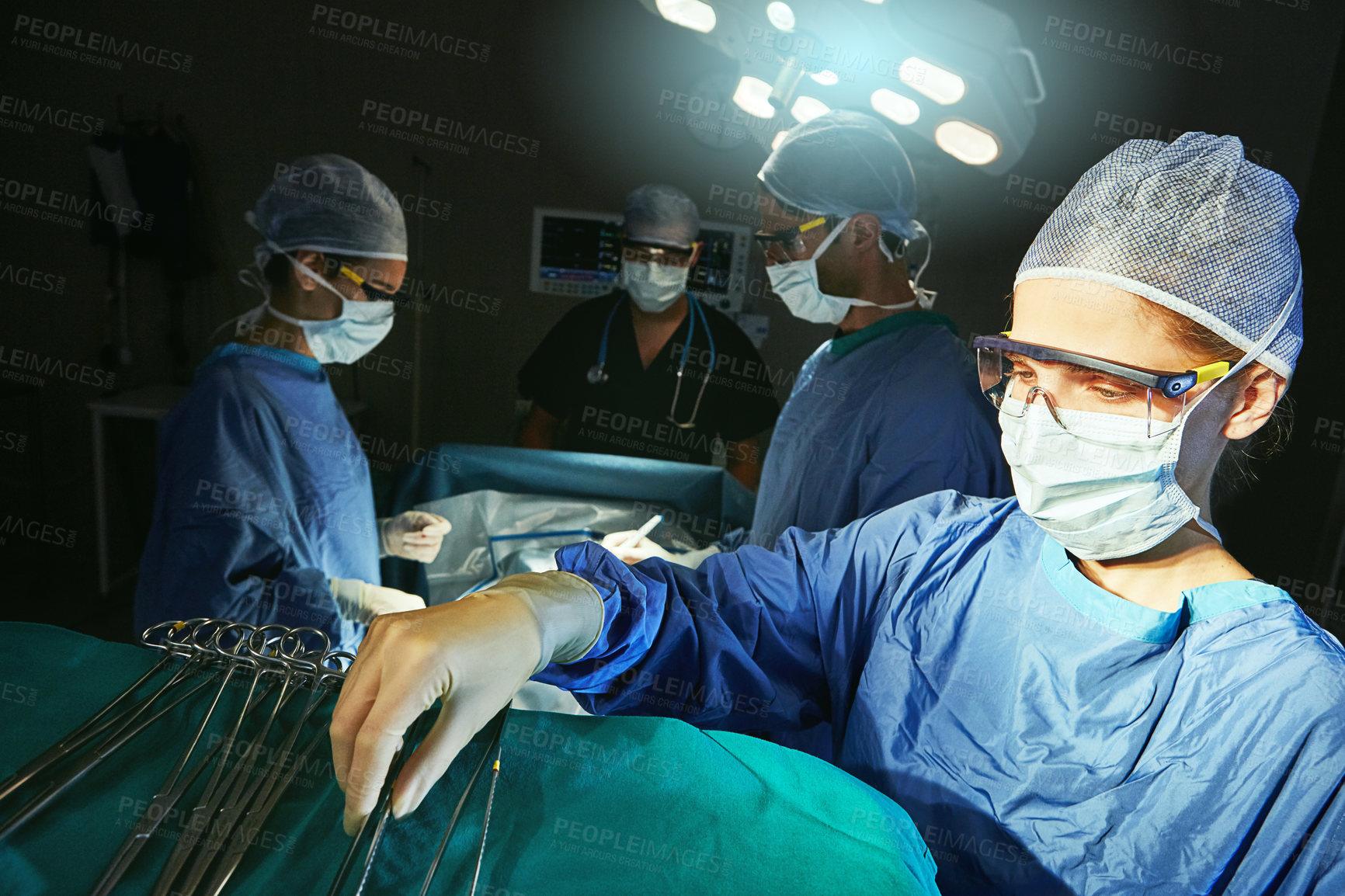 Buy stock photo Cropped shot of surgeons in an operating room