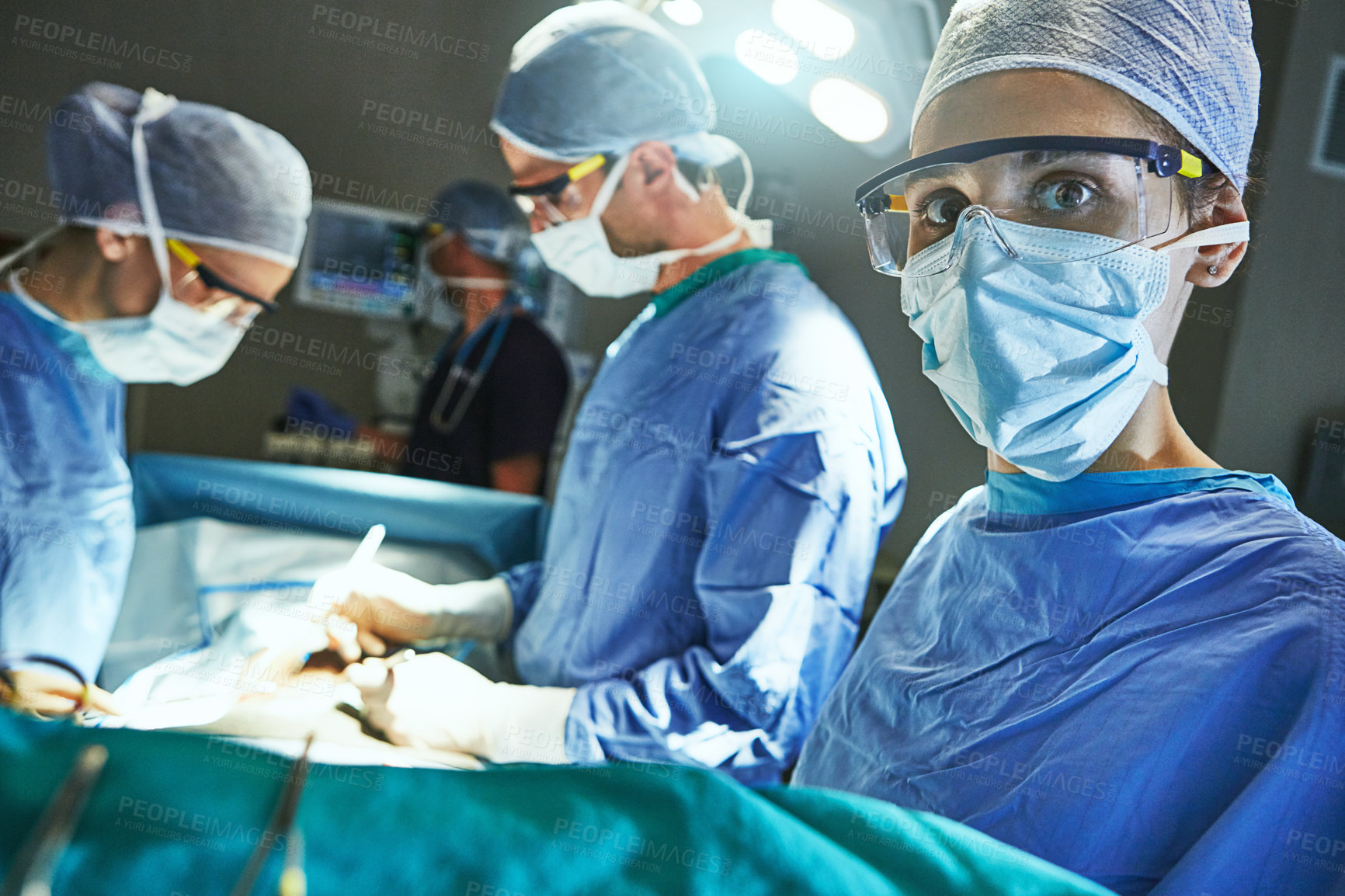 Buy stock photo Cropped shot of surgeons in an operating room