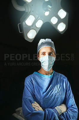 Buy stock photo Cropped portrait of a female doctor against a dark background