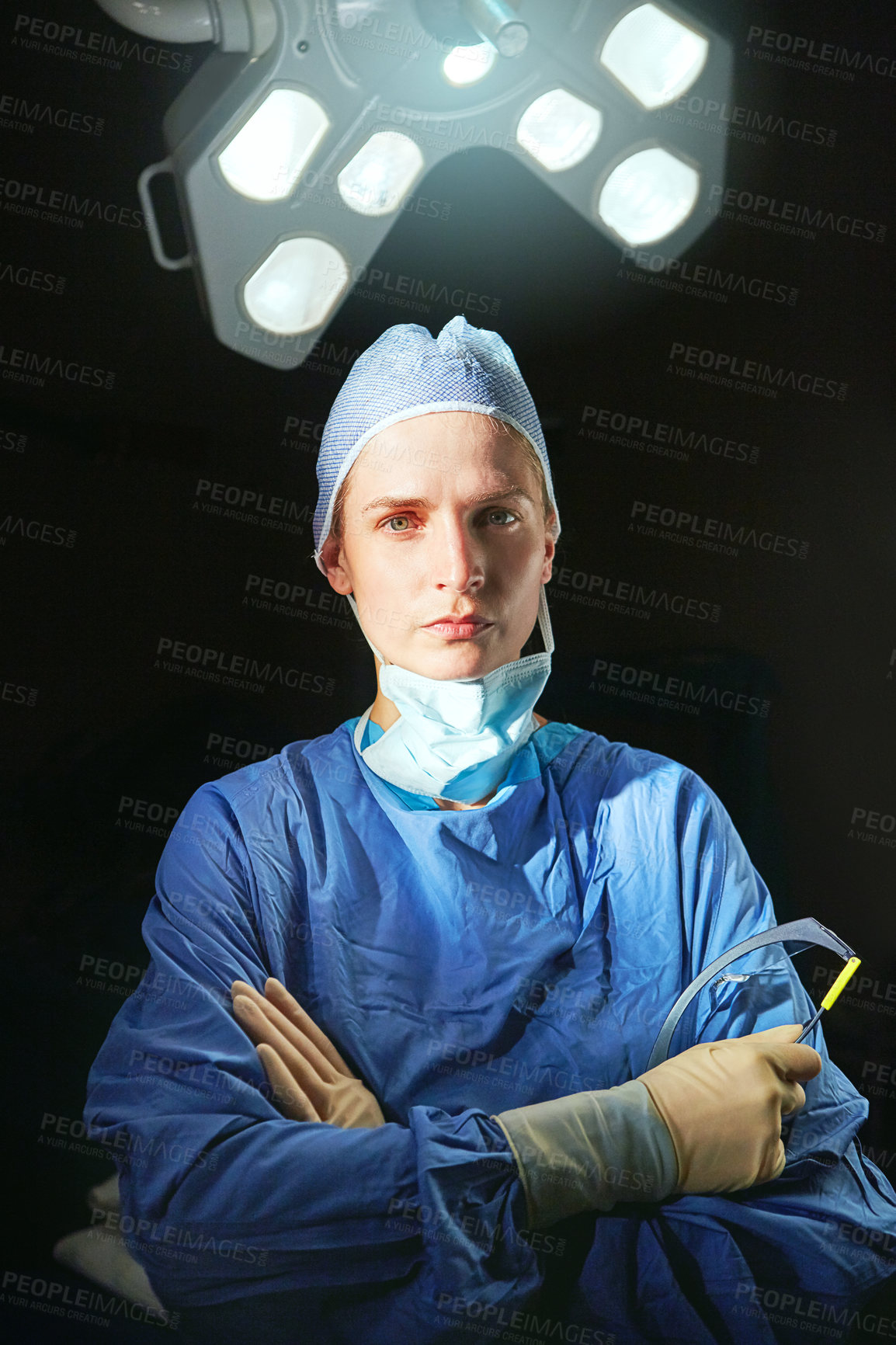 Buy stock photo Cropped portrait of a female doctor against a dark background