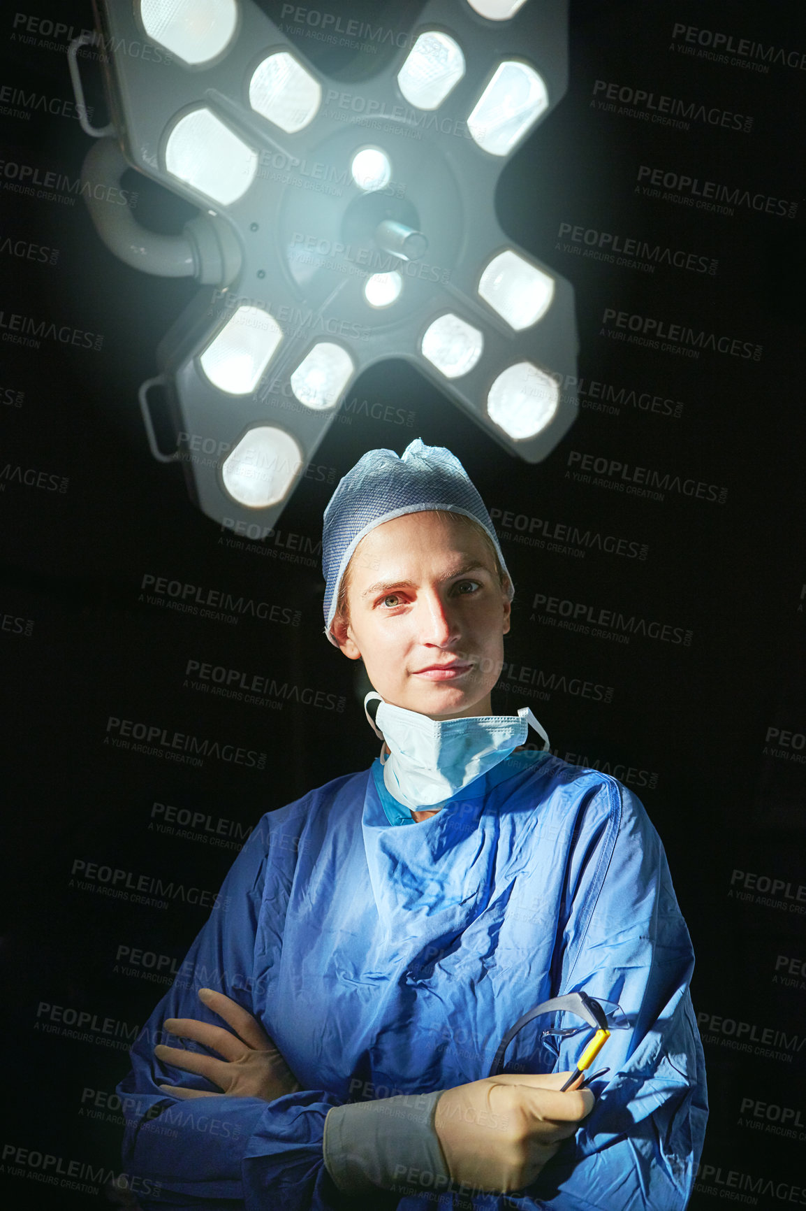 Buy stock photo Cropped portrait of a female doctor against a dark background