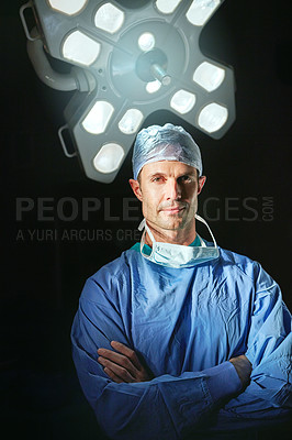 Buy stock photo Cropped portrait of a male doctor against a dark background