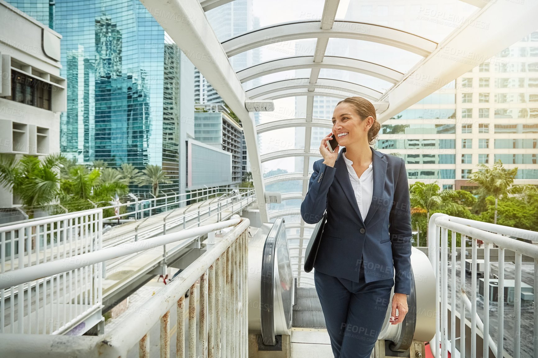 Buy stock photo Phone call, business or woman in city with smile, networking or client discussion in morning commute. Digital, travel or consultant with tech, schedule meeting or stakeholder feedback at start of day
