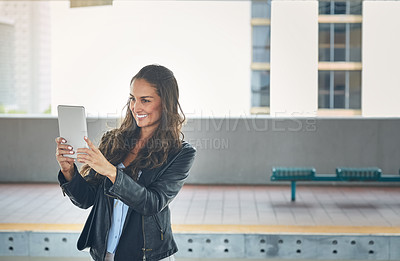 Buy stock photo Shot of a young woman taking a selfie at a train station