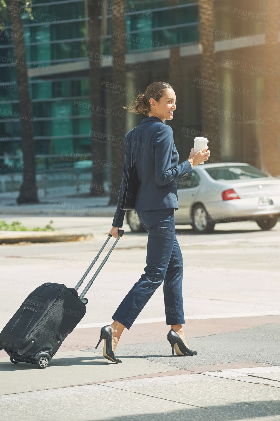 Buy stock photo Shot of a young businesswoman on the move in the city