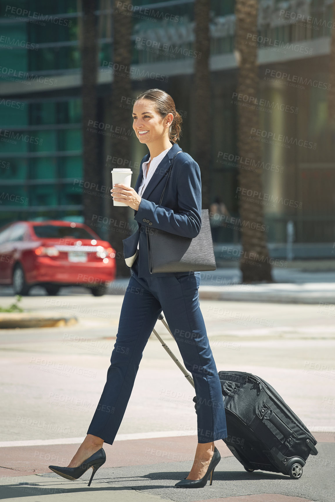 Buy stock photo Shot of a young businesswoman on the move in the city