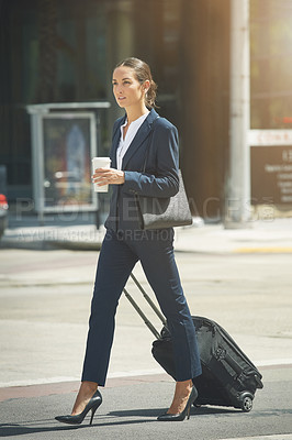 Buy stock photo Shot of a young businesswoman on the move in the city