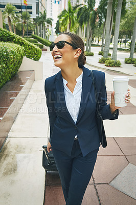 Buy stock photo Shot of a young businesswoman on the move in the city