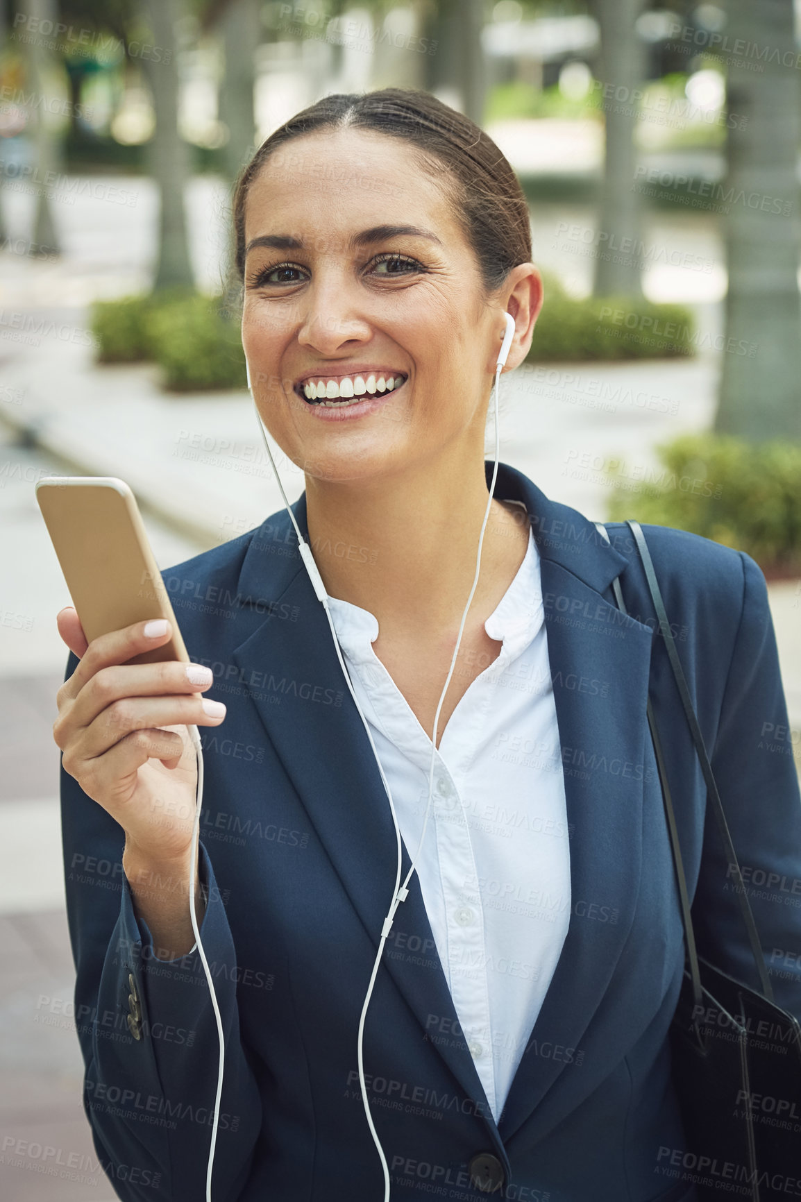 Buy stock photo Shot of a young businesswoman on the move in the city