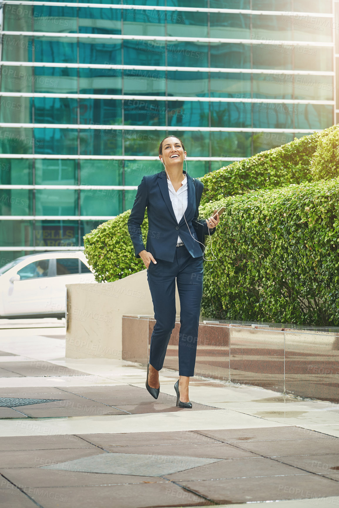 Buy stock photo Shot of a young businesswoman on the move in the city