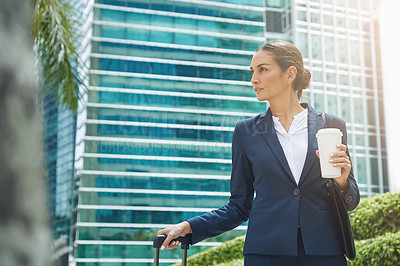 Buy stock photo Shot of an ambitious young businesswoman on the move in the city