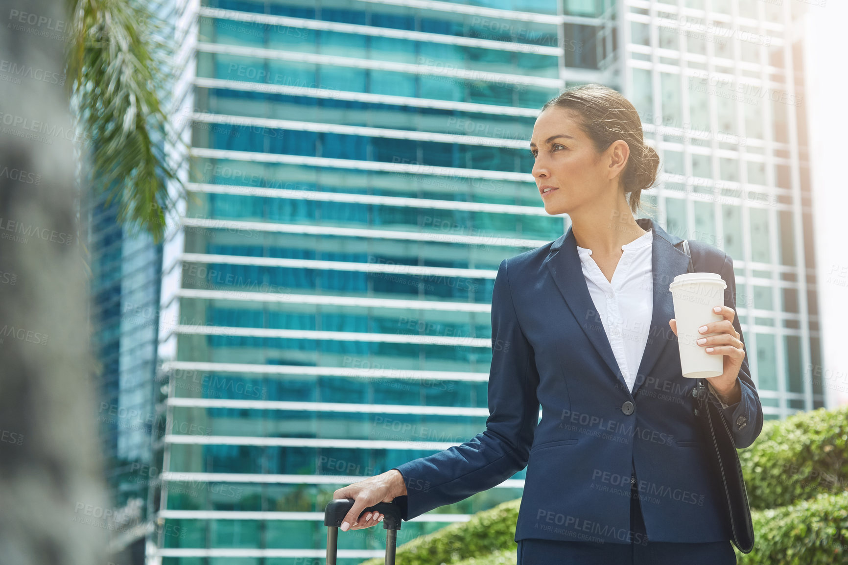 Buy stock photo Shot of an ambitious young businesswoman on the move in the city