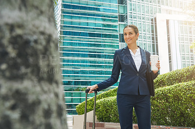 Buy stock photo Shot of an ambitious young businesswoman on the move in the city