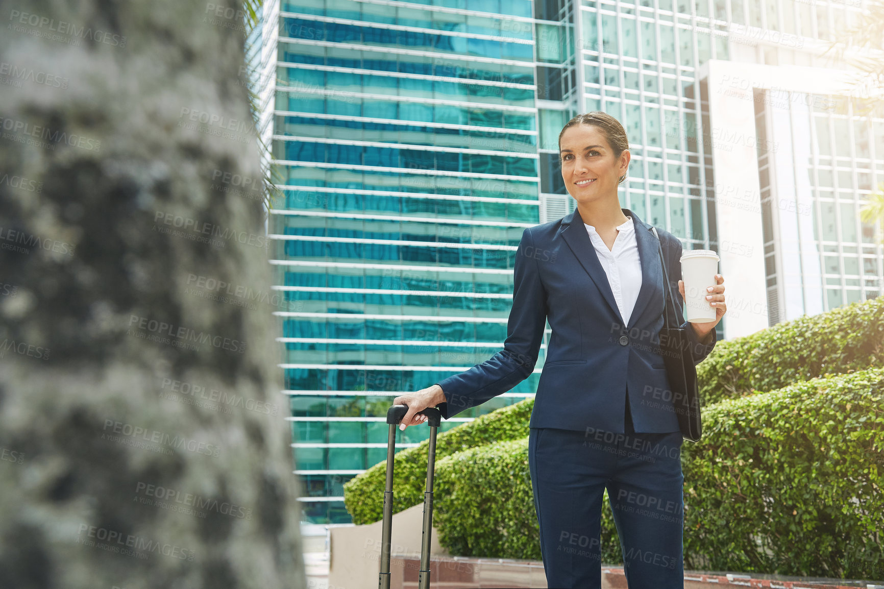 Buy stock photo Shot of an ambitious young businesswoman on the move in the city