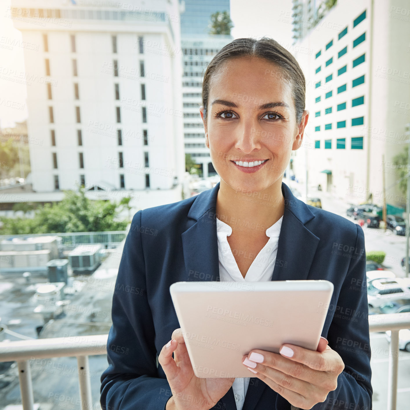 Buy stock photo Portrait of a young businesswoman using a digital tablet on her way to the office