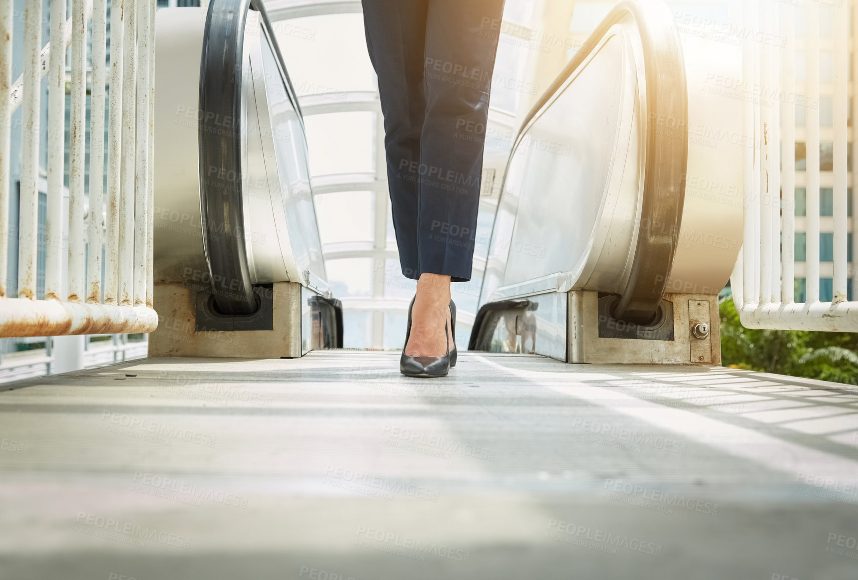 Buy stock photo Shot of a young businesswoman legs walking to work in the city