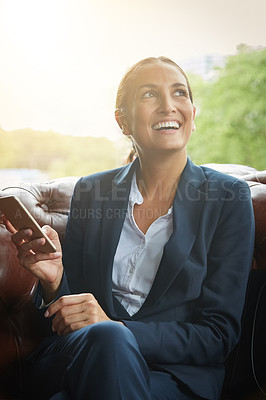 Buy stock photo Shot of a young businesswoman using a cellphone