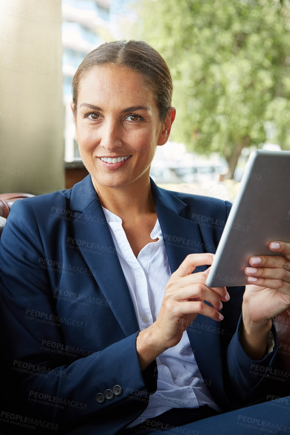 Buy stock photo Woman, tablet and portrait in office lounge with notification, review and contact for property sale. Person, real estate agent and happy on couch with tech, application and pride at company in Spain