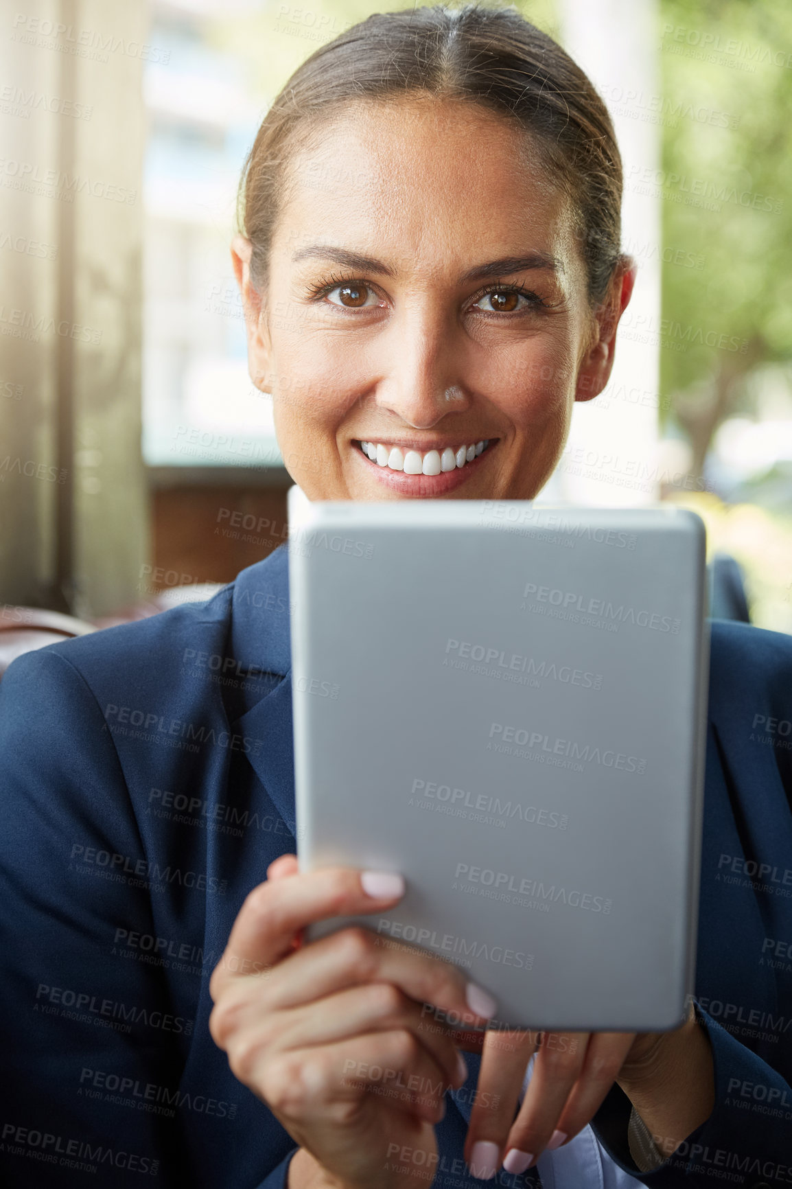 Buy stock photo Portrait of a young businesswoman using a digital tablet outside