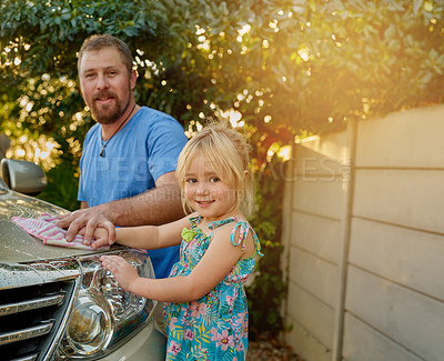 Buy stock photo Outdoors, man and girl with cleaning car in backyard for maintenance, teamwork and childhood development. Dad, portrait and kid in nature with washing vehicle for teaching, hygiene and support