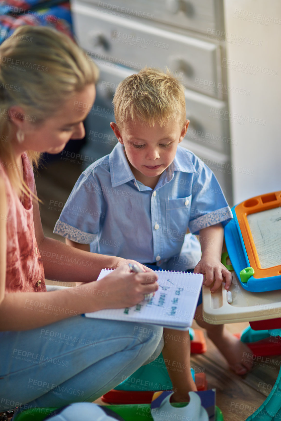 Buy stock photo Mother, young child and checklist in bedroom for learning, motor skills and development in apartment. To do list, writing and boy in house for lesson, homeschool and support for kindergarten student