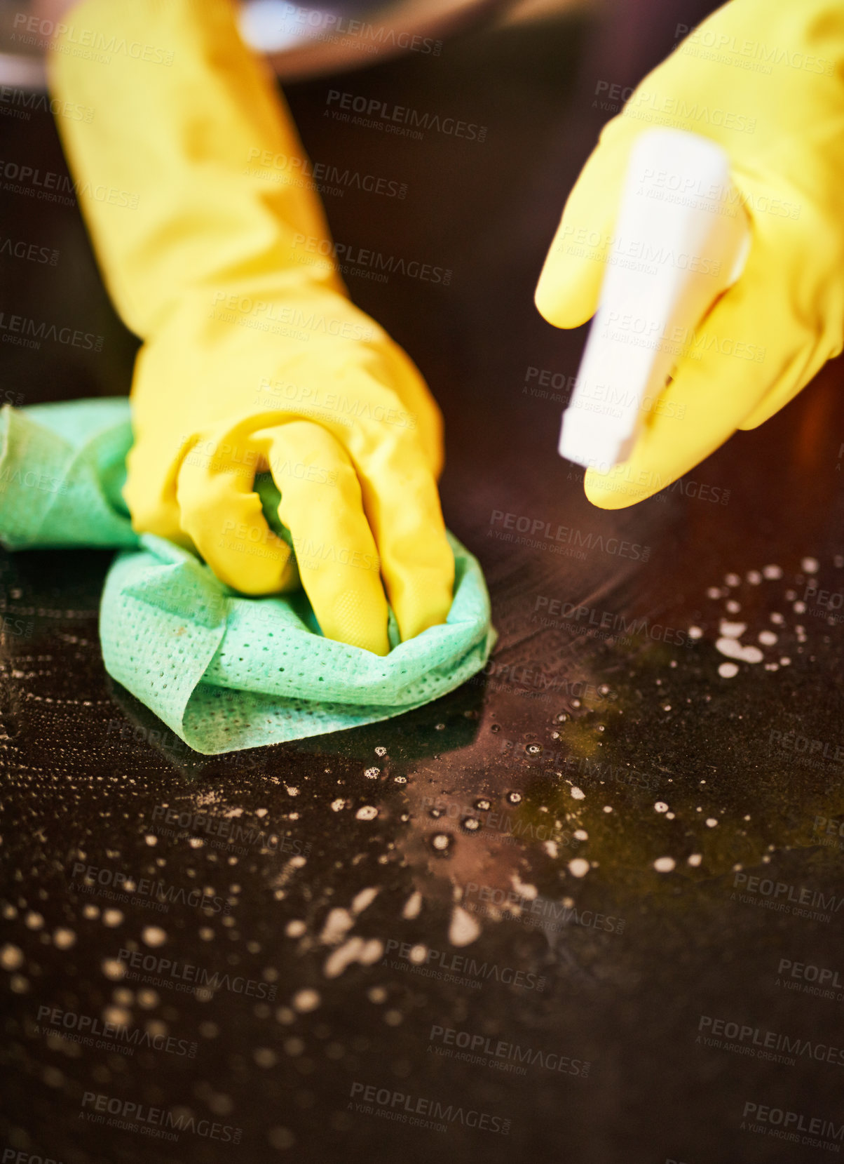 Buy stock photo Hands, wipe and spray surface of table in home, maid and disinfection for hygiene or housekeeping. Person, chemical and fabric or cloth to tidy, bacteria and gloves to protect from germs or dirt
