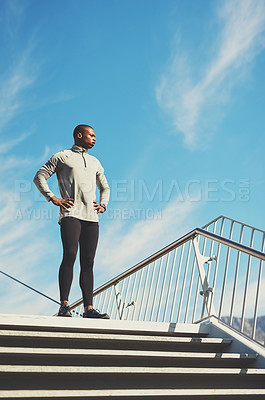 Buy stock photo Shot of a young sporty man standing outside