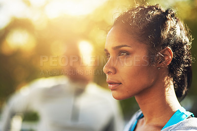 Buy stock photo Shot of a young sporty couple out for a workout