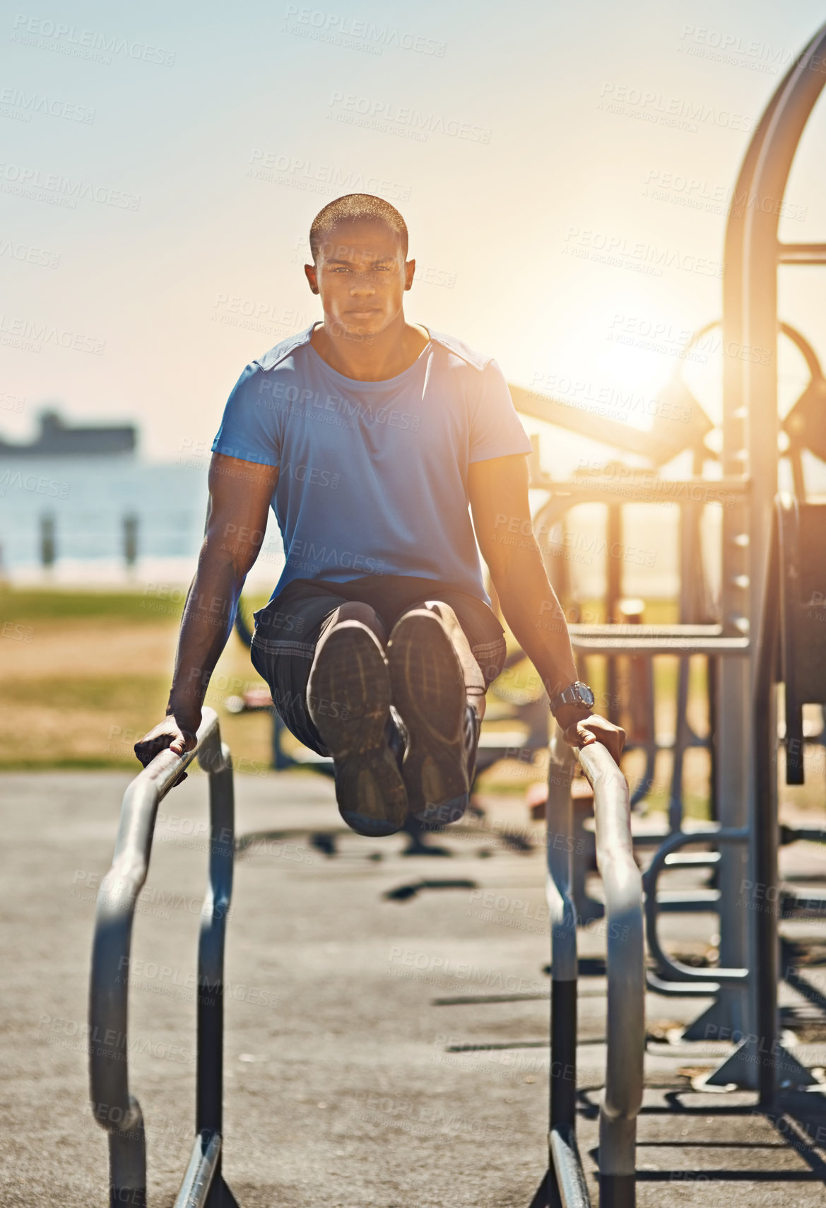 Buy stock photo Portrait of a young sporty man exercising outside