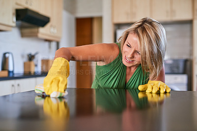 Buy stock photo Woman, spring cleaning and wipe countertop with cloth for hygiene, bacteria and healthcare. Female person, ocd and scrubbing in kitchen for housekeeping service, task and stain on home furniture.