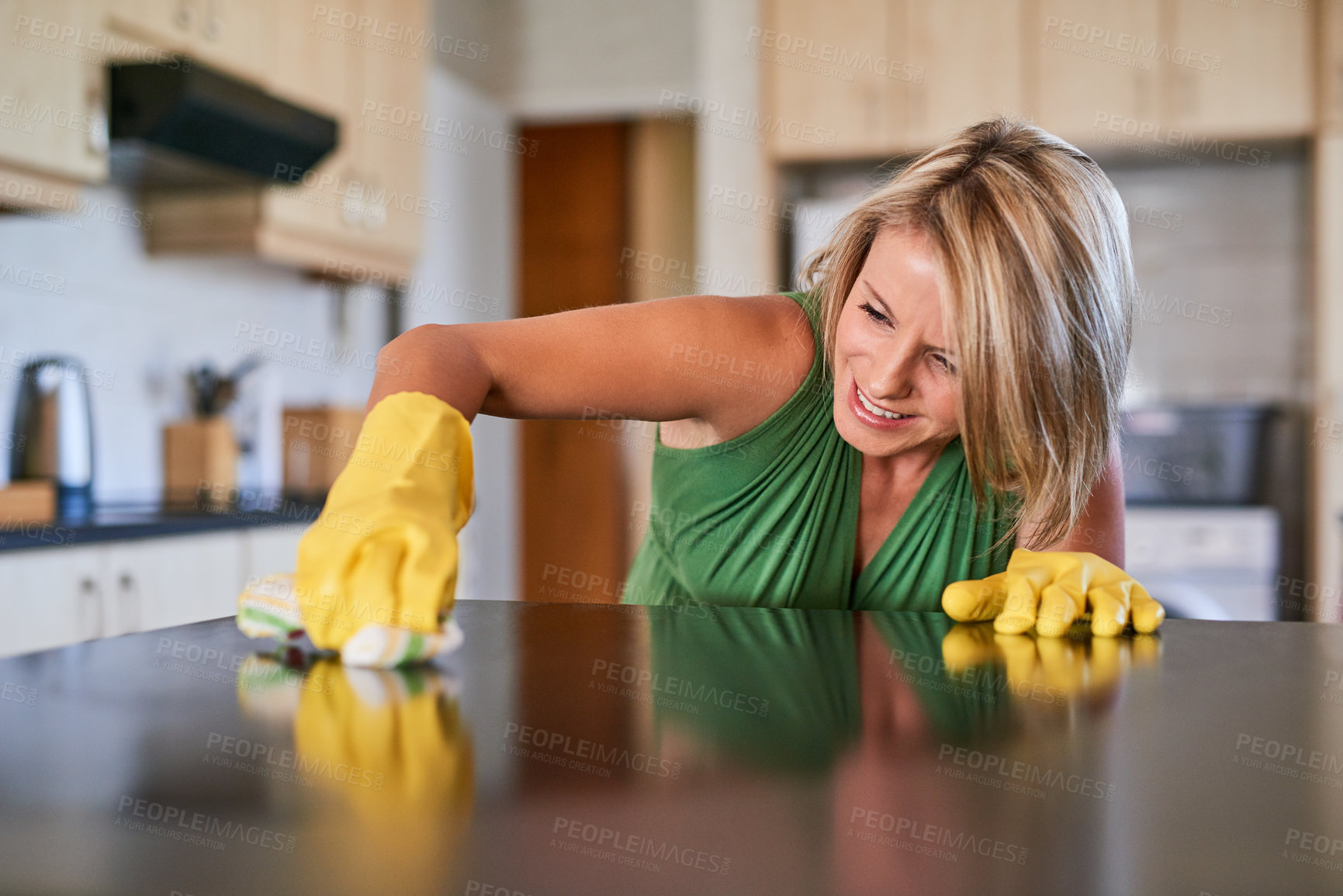 Buy stock photo Woman, spring cleaning and wipe countertop with cloth for hygiene, bacteria and healthcare. Female person, ocd and scrubbing in kitchen for housekeeping service, daily task and home furniture.