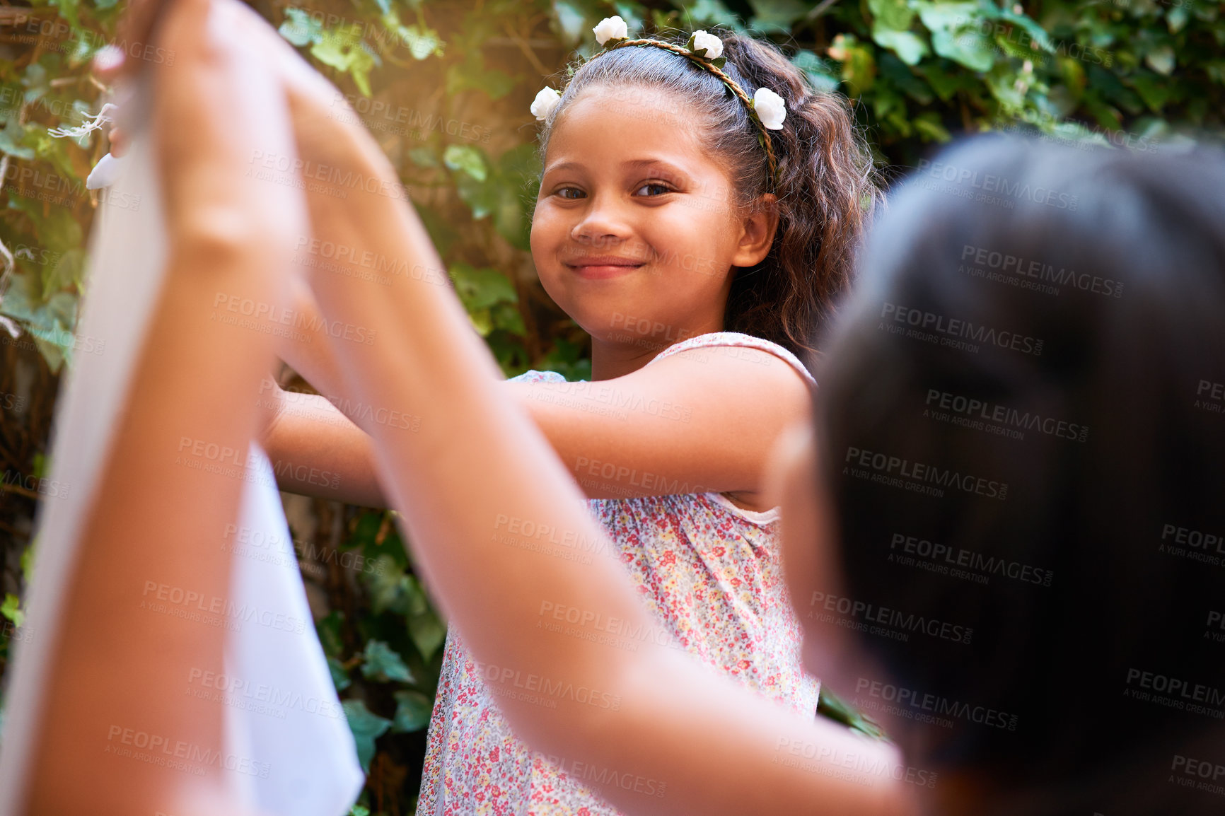Buy stock photo Portrait, smile and girl hanging washing in backyard with mother for cleaning or laundry together. Family, child and happy young child with woman parent in garden for housekeeping or chores in spring