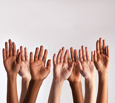 Buy stock photo Cropped shot of a diverse group of people raising their hands