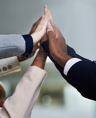 Buy stock photo Cropped shot of a group of colleagues giving each other a high five