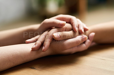 Buy stock photo Comfort, holding hands and support of friends, care and empathy together on table after cancer. Kindness, love and women hold hand for hope, trust or prayer, solidarity or compassion, help or unity.