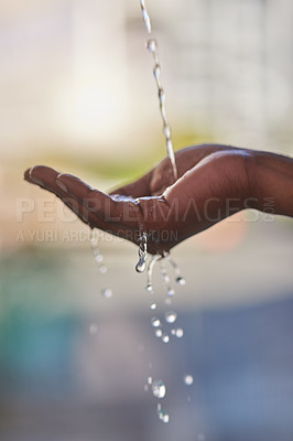 Buy stock photo Hand, hygiene or running water on blurred background for sustainability, awareness for resources on earth. Closeup, fingers or under with liquid or skin for renewable, clean or nature with splash